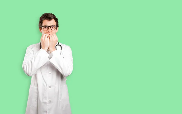 Nervous doctor against white background