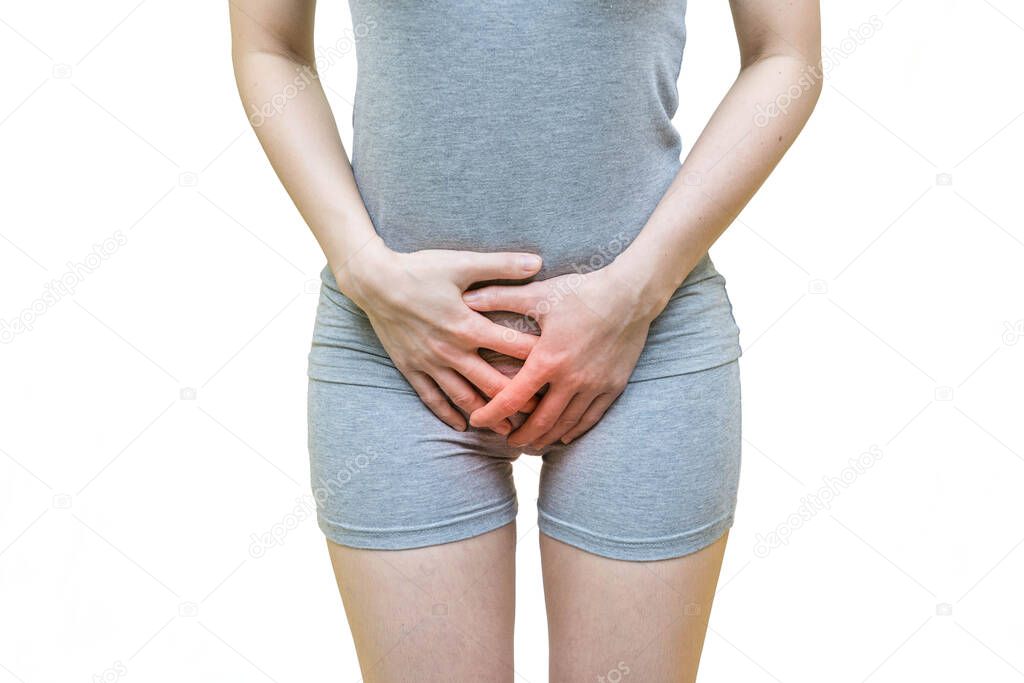 low body of a woman in gray clothes put her hands holding crotch pants,  Itching urinary, Health-care concept on white background