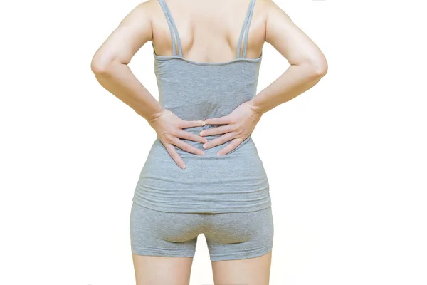 健康护理概念白底妇女的身体后面穿白衣的妇女双手放在腰痛或腰痛的后背部位 — 图库照片