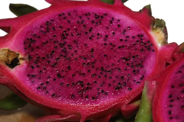 tropical fruit pink pitahaya isolated on white. closeup of dragon fruit for background