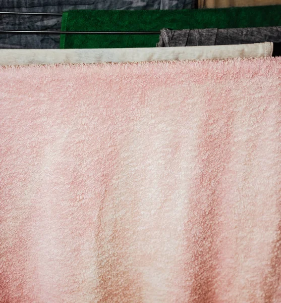 colorful clothes hanged for drying after laundry clothes airer, clothes dryer.