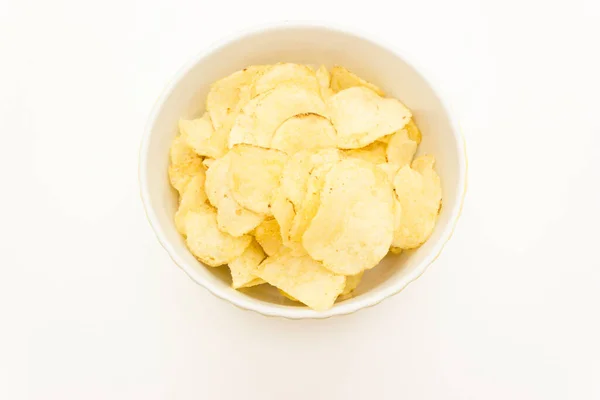 Plate with chips on a white background top view — Stock Photo, Image