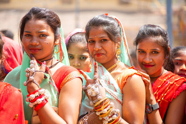 ALIRAJPUR, MADHYA PRADESH, INDIA, 15 MARCH 2022 : Tribal women gathered together at the Bhagoria tribal festival, In this festival young boys and girls choosing their partners before marriage