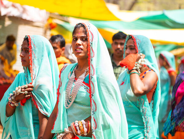 ALIRAJPUR, MADHYA PRADESH, INDIA, 15 MARCH 2022 : Tribal women gathered together at the Bhagoria tribal festival, In this festival young boys and girls choosing their partners before marriage
