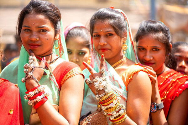 ALIRAJPUR, MADHYA PRADESH, INDIA, 15 MARCH 2022 : Tribal women gathered together at the Bhagoria tribal festival, In this festival young boys and girls choosing their partners before marriage