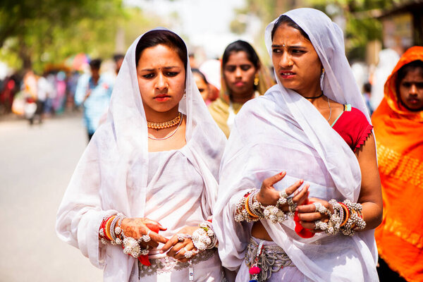 ALIRAJPUR, MADHYA PRADESH, INDIA, 15 MARCH 2022 : Tribal women gathered together at the Bhagoria tribal festival, In this festival young boys and girls choosing their partners before marriage