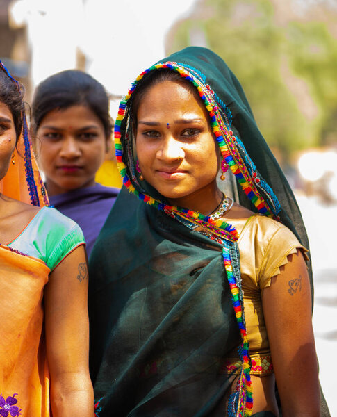 ALIRAJPUR, MADHYA PRADESH, INDIA, 15 MARCH 2022 : Tribal women gathered together at the Bhagoria tribal festival, In this festival young boys and girls choosing their partners before marriage