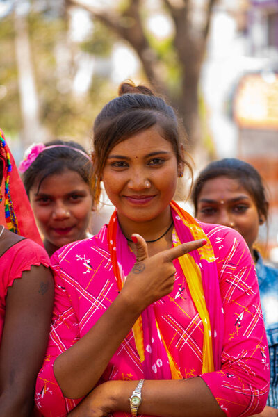 ALIRAJPUR, MADHYA PRADESH, INDIA, 15 MARCH 2022 : Tribal women gathered together at the Bhagoria tribal festival, In this festival young boys and girls choosing their partners before marriage