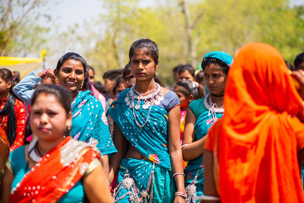 ALIRAJPUR, MADHYA PRADESH, INDIA, 15 MARCH 2022 : Tribal women gathered together at the Bhagoria tribal festival, In this festival young boys and girls choosing their partners before marriage