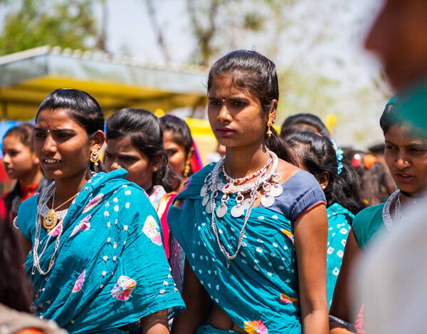 ALIRAJPUR, MADHYA PRADESH, INDIA, 15 MARCH 2022 : Tribal women gathered together at the Bhagoria tribal festival, In this festival young boys and girls choosing their partners before marriage