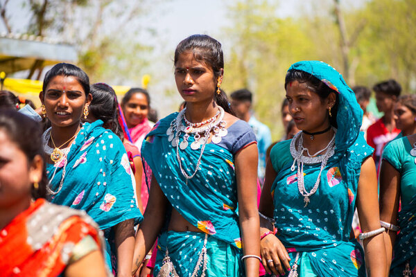 ALIRAJPUR, MADHYA PRADESH, INDIA, 15 MARCH 2022 : Tribal women gathered together at the Bhagoria tribal festival, In this festival young boys and girls choosing their partners before marriage