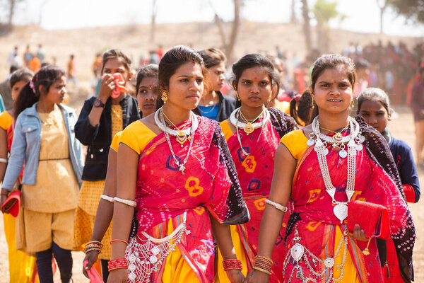 ALIRAJPUR, MADHYA PRADESH, INDIA, 15 MARCH 2022 : Tribal women gathered together at the Bhagoria tribal festival, In this festival young boys and girls choosing their partners before marriage