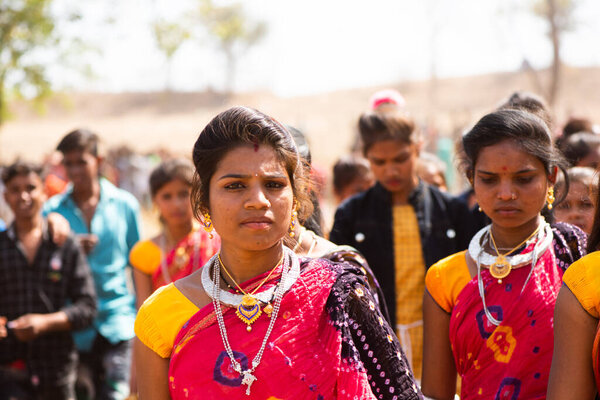 ALIRAJPUR, MADHYA PRADESH, INDIA, 15 MARCH 2022 : Tribal women gathered together at the Bhagoria tribal festival, In this festival young boys and girls choosing their partners before marriage