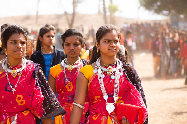 ALIRAJPUR, MADHYA PRADESH, INDIA, 15 MARCH 2022 : Tribal women gathered together at the Bhagoria tribal festival, In this festival young boys and girls choosing their partners before marriage