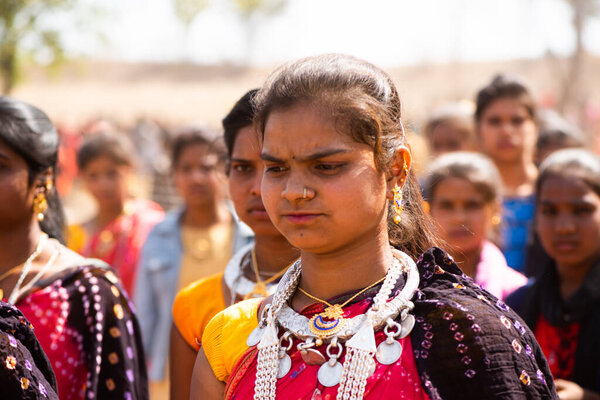 ALIRAJPUR, MADHYA PRADESH, INDIA, 15 MARCH 2022 : Tribal women gathered together at the Bhagoria tribal festival, In this festival young boys and girls choosing their partners before marriage