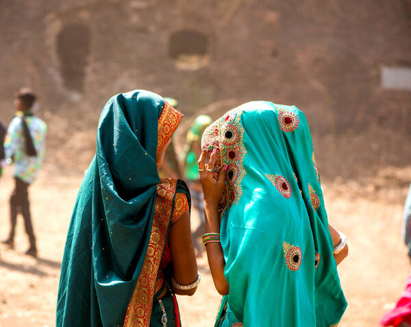 ALIRAJPUR, MADHYA PRADESH, INDIA, 15 MARCH 2022 : Tribal women gathered together at the Bhagoria tribal festival, In this festival young boys and girls choosing their partners before marriage