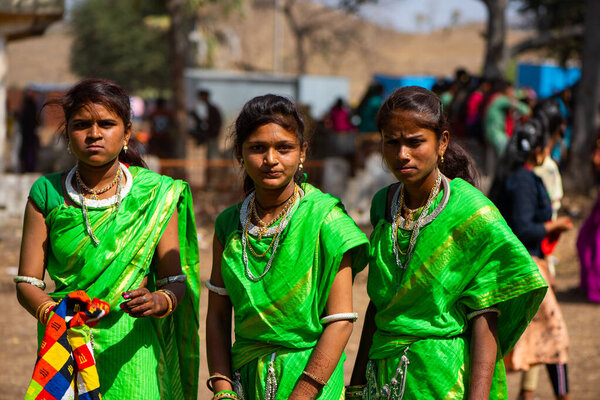 ALIRAJPUR, MADHYA PRADESH, INDIA, 15 MARCH 2022 : Tribal women gathered together at the Bhagoria tribal festival, In this festival young boys and girls choosing their partners before marriage