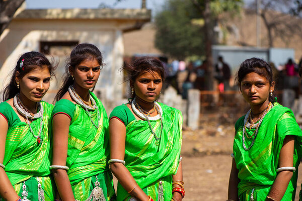 ALIRAJPUR, MADHYA PRADESH, INDIA, 15 MARCH 2022 : Tribal women gathered together at the Bhagoria tribal festival, In this festival young boys and girls choosing their partners before marriage