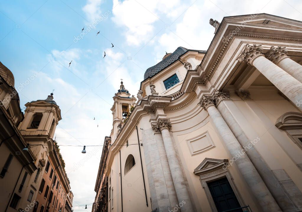 Baroque Church of Saint Mary in Montesanto at Piazza del Popolo in Rome under Blue Sky, Italy