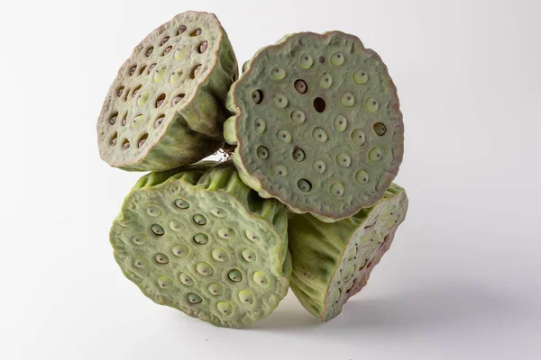 4 green Lotus seeds on a white background