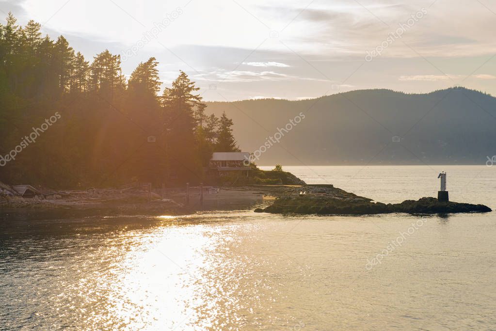 Sunset view of the shoreline of Bowen Island in the west coast of Vacouver, British Columbia, Canada