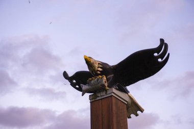 View of bald eagle wood sculpture in Port Alberni, a small town in Vancouver Island, Canada clipart