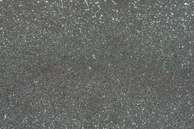 Gri bir arkaplanda beyaz bokeh soyutu, Noel konsepti, 2021 yılbaşı. Odaklanmayın