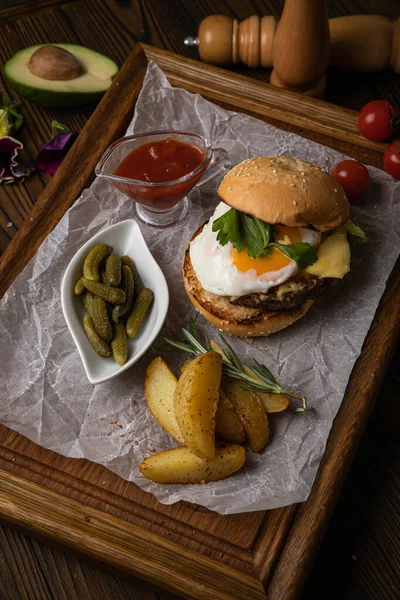 Hamburger Cutlet Cheese Sauces Salad French Fries Wooden Background — Zdjęcie stockowe