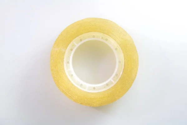 Roll Yellow Tape Lying Center White Surface — Stock Photo, Image