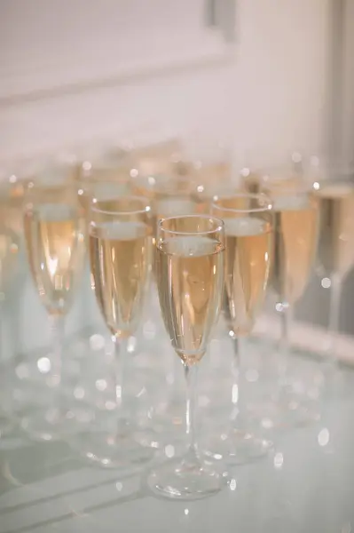 Buffet, glasses of champagne, sparkling wine, sparkling in the sun. Catering, party service. Festive event, welcome drink