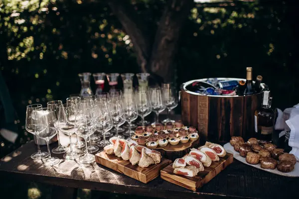 Cold drinks, alcoholic and non-alcoholic drinks and canaps on the buffet. Catering, service, aperitif. Celebration, event under the open sky outside