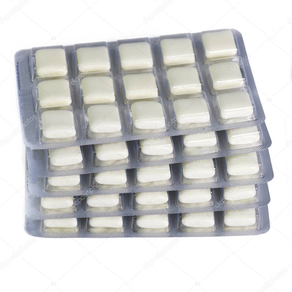 stack of nicotine gum for giving up smoking for health reasons  isolated on a white background 