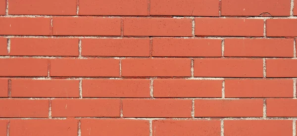 Textura de tijolo vermelho. Parede de tijolo marrom com costura — Fotografia de Stock
