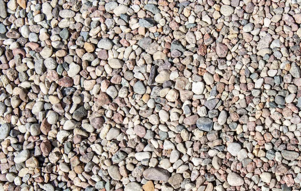 Textura de cascalho, pedras pequenas, seixos closeup — Fotografia de Stock