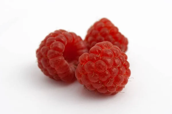 Three ripe raspberries isolate on white background — Stock Photo, Image