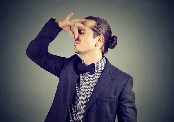 Disgusted Man Pinches Nose Fingers Looks Disgust Something Stinks Bad — Stock Photo, Image