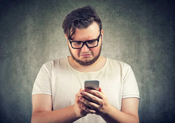 Casual Sad Young Man Received Offensive Message Smartphone Looking Upset — Stock Photo, Image