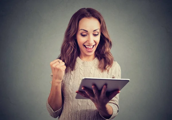 Cheerful Cute Woman Holding Fist Happy Success While Using Tablet — Stock Photo, Image