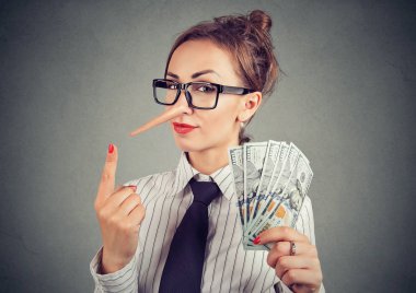 Financial fraud concept. Liar businesswoman with dollar cash and sly look  clipart