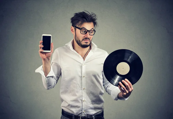 Young Bearded Man Glasses Looking Puzzled While Choosing Vinyl Disk — Stock Photo, Image