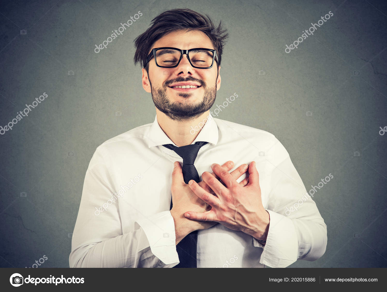 Man Eyes Closed Keeps Hands Chest Heart Shows Kindness Expresses Stock  Photo by ©SIphotography 202015886