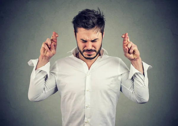 Young Man Keeping Fingers Crossed Making Wish — Stock Photo, Image