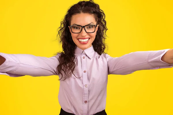 Cheerful Young Woman Glasses Looking Camera Taking Selfie Bright Yellow — Stock Photo, Image