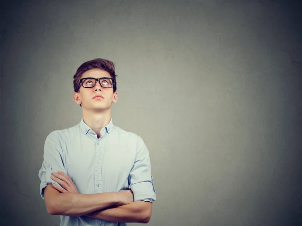 Thoughtful Young Man Glasses Arms Crossed Looking Contemplating Future Plans Stock Picture