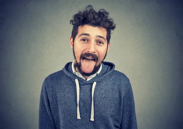 Young Casual Hipster Man Making Faces Showing Tongue Camera Being — Stock Photo, Image