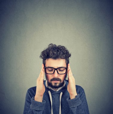Closeup sad young man with worried stressed face expression. Obsessive compulsive, adhd, anxiety disorders