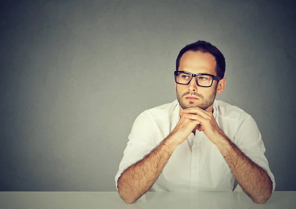 Adult Sad Man White Shirt Glasses Sitting Table Leaning Hands — Stock Photo, Image