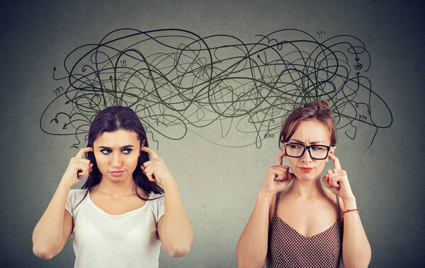 Two angry displeased with each other women ignoring not listening each other exchanging with many negative thoughts 