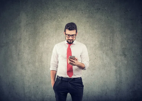 Young businessman using a mobile phone — Stock Photo, Image