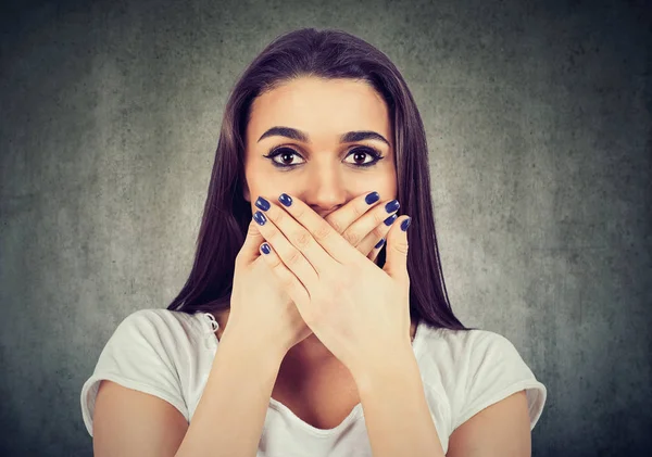 Scared woman covers her mouth to keep it quiet — Stock Photo, Image
